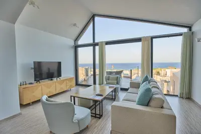a living room with a view of the ocean at VESTA - Soma Bay Residence in Hurghada