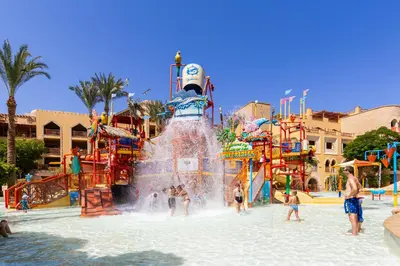 a group of children playing in a water park at Grand Waterworld Makadi - Couples and Families Only in Hurghada