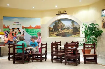 a group of children sitting at a table in a restaurant at Hurghada Coral Beach Hotel in Hurghada