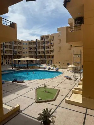a swimming pool in the middle of a building at Budget studio near El Gouna and Kite station in Hurghada