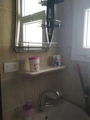 a bathroom with a sink and a mirror at Budget studio near El Gouna and Kite station in Hurghada