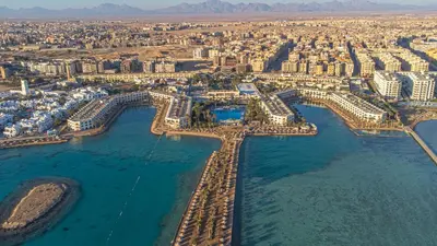 an aerial view of a city with buildings and water at Arabia Azur Resort in Hurghada
