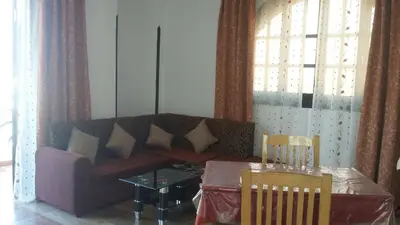 a living room with a couch and a table at Villa Dream in Luxor