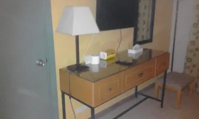 a lamp on top of a dresser in a room at EL Gouna Abu tig marina studio- economy stay in Hurghada