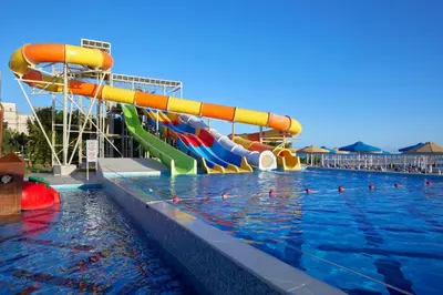 a water slide in a swimming pool at a resort at Bellagio Beach Resort & Spa in Hurghada