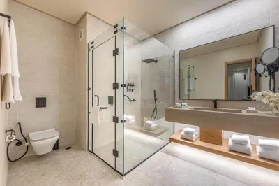 a bathroom with a shower and a toilet and a sink at Desert Rose in Hurghada