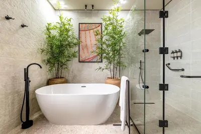 a bathroom with a white tub and potted plants at Desert Rose in Hurghada