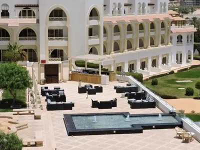 a view of the courtyard of a building with a swimming pool at Old Palace Resort Sahl Hasheesh in Hurghada
