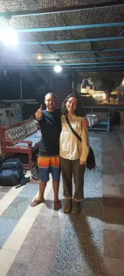 two people posing for a picture in a room at Awi Guest House in Aswan