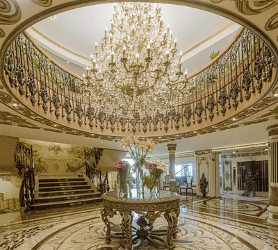 a large room with a chandelier and a table with flowers at Sonesta St George Nile Cruise - Aswan to Luxor 3 Nights from Friday to Monday in Aswan