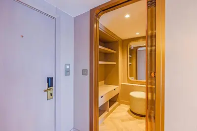 a small bathroom with a toilet and a walk in closet at Sonesta St George Nile Cruise - Aswan to Luxor 3 Nights from Friday to Monday in Aswan