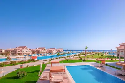 an aerial view of a resort with a swimming pool at Pickalbatros Sea World Resort - Marsa Alam- 
