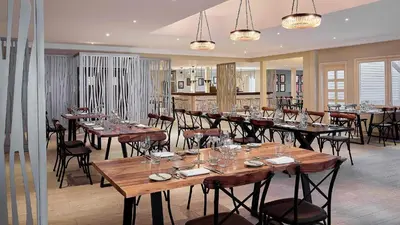 a dining room with tables and chairs in a restaurant at Steigenberger Pure Lifestyle (Adults Only) in Hurghada