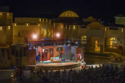 a stage with a show on it at night at Concorde Moreen Beach Resort in Abu Dabab