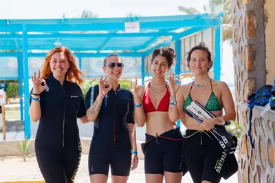 a group of women standing next to a wall at Blend Elphistone Resort Marsa Alam in Abu Dabab