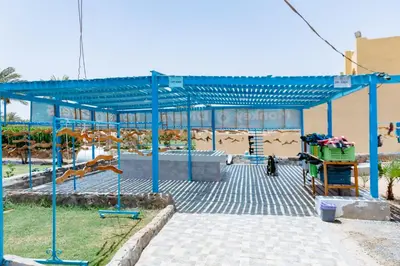 a blue structure with a slide in a park at Blend Elphistone Resort Marsa Alam in Abu Dabab