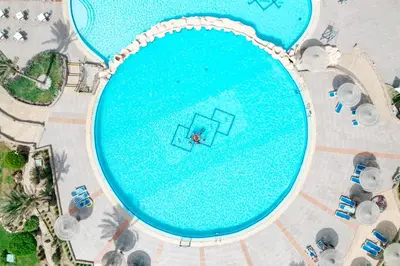 an overhead view of a large swimming pool at Blend Elphistone Resort Marsa Alam in Abu Dabab