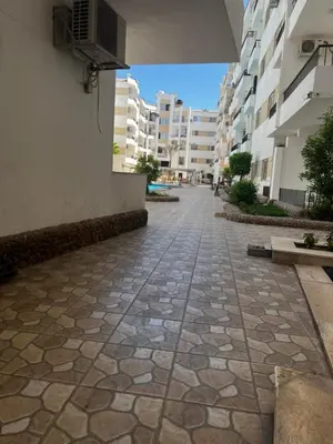 a stone walkway in the middle of a building at Lotus compound in Hurghada
