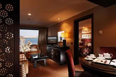 a living room with a couch and a table at Steigenberger Omar El Khayam Nile Cruise - Every Monday from Aswan for 07 & 04 Nights - Every Friday From Abu Simbel for 03 Nights in Aswan
