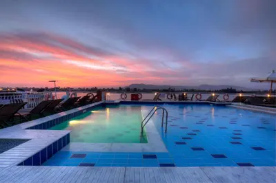 a swimming pool on a cruise ship at sunset at Steigenberger Minerva Nile Cruise - Every Thursday from Luxor for 07 & 04 Nights - Every Monday From Aswan for 03 Nights in Luxor