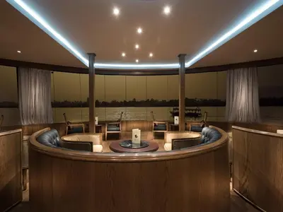 a large room with a round table and chairs at Steigenberger Regency Nile Cruise - Every Saturday from Luxor for 07 & 04 Nights - Every Wednesday From Aswan for 03 Nights in Luxor