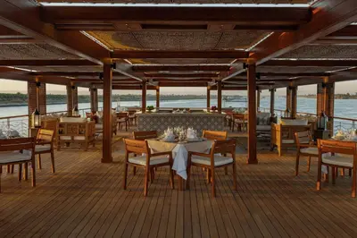 a restaurant on the deck of a cruise ship at JAZ Elite Senator Nile Cruises - Every Thursday from Luxor for 07 Nights & Every Thursday from Luxor for 05 Nights in Luxor