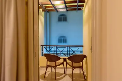 a table and two chairs in a hallway at Bahga Palace 1 Residential Apartments in Hurghada