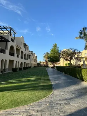 a cobblestone street in front of a building at Stella Gardens Resort & Spa, Makadi Bay in Hurghada