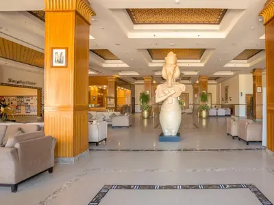 a lobby with a statue in the middle of it at Stella Gardens Resort & Spa, Makadi Bay in Hurghada