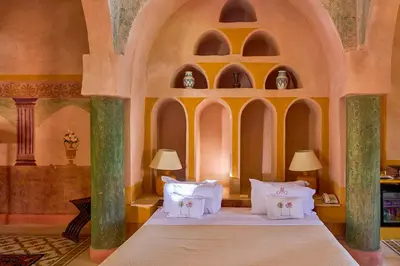 a bedroom with a large bed in a room at Al Moudira Hotel in Luxor