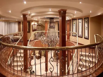a circular staircase with a chandelier in a house at Nile Cruises 5 Stars From From Aswan 03 Nights -From Luxor 04 Nights in Luxor