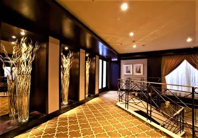 a large room with a hallway with vases on the wall at Steigenberger Legacy Nile Cruise - Every Monday 07 & 04 Nights from Luxor - Every Friday 03 Nights from Aswan in Luxor