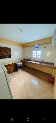 a large room with a kitchen with a counter at Leyla Eco Resort in Luxor