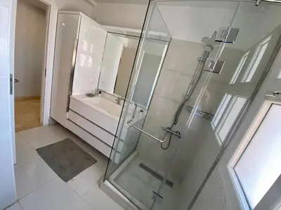 a bathroom with a glass shower and a sink at El Gouna Abu Tig Marina OV3550 in Hurghada