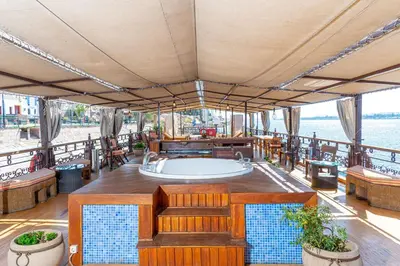 a boat with a bath tub on the deck at Sonesta Dahabeya Amirat I - Nile Cruise Ship From Luxor to Aswan 7 nights in Luxor