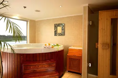 a bathroom with a bath tub and a window at Sonesta Star Goddess Cruise - Luxor- Aswan - 04 & 07 nights Each Saturday in Luxor