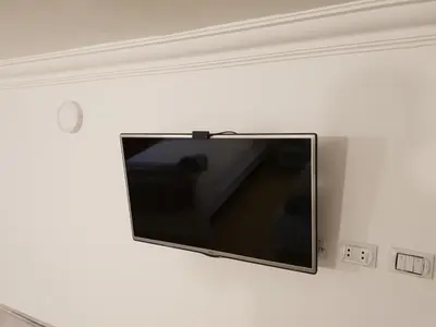 a flat screen tv hanging on a wall at One Bedroom Chalet managed by Lilly Homes in Hurghada