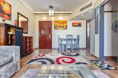 a living room with a couch and a table at Nubian Village Sky, Hurghada in Hurghada