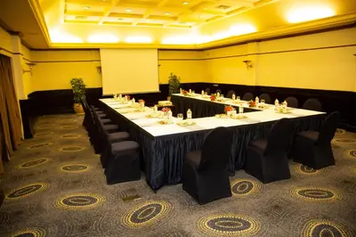 a conference room with a long table and chairs at Swiss Inn Resort Hurghada in Hurghada
