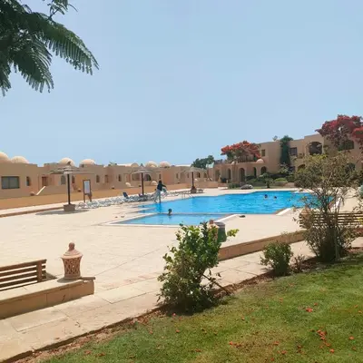a swimming pool in the middle of a resort at One bedroom Apt at The View - B104 in Hurghada