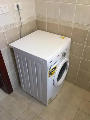a washing machine in a corner of a room at One bedroom Apt at The View - B104 in Hurghada
