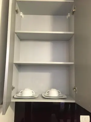 two plates on shelves in a walk in closet at One bedroom Apt at The View - B104 in Hurghada