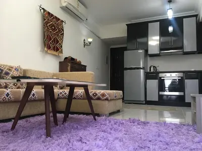 a living room with a couch and a table at Sea View One Bedroom in Hurghada - H105 in Hurghada