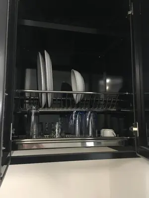 a kitchen shelf with plates and dishes on it at Sea View One Bedroom in Hurghada - H105 in Hurghada