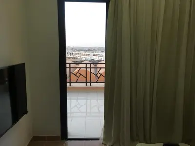 a room with a window with a view of a balcony at Sea View One Bedroom in Hurghada - H105 in Hurghada