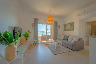 a living room with a couch and a table at Golden Apartments El Gouna in Hurghada