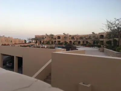 a view of a building with a parking lot at Studio Sea view At Hurghada - A105 in Hurghada