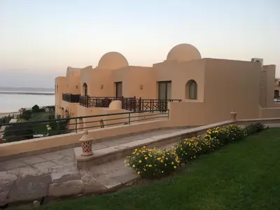 a large house with a lawn and flowers at Studio Sea view At Hurghada - A105 in Hurghada