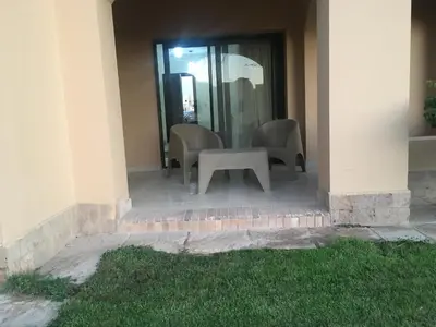 a table and chairs sitting outside of a building at Pool View one bedroom at Hurghada - B101 in Hurghada