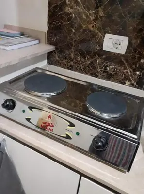 a stove top with two plates on top of it at Apartment in Stella di Mare Hurghada in Hurghada